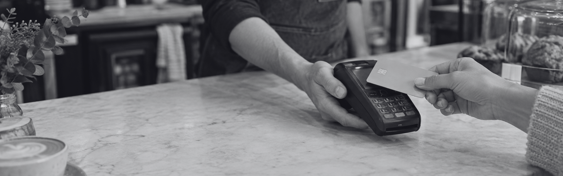 Customer making a contactless card payment at a small business